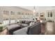 Large living room boasts a stylish grey sectional sofa and elegant fireplace at 591 E Morningside Ne Dr, Atlanta, GA 30324