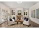 Living room featuring neutral walls, fireplace, and access to the outdoors at 591 E Morningside Ne Dr, Atlanta, GA 30324