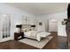 Serene bedroom featuring a plush bed, dark furniture, and beautiful hardwood flooring at 591 E Morningside Ne Dr, Atlanta, GA 30324