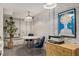 Basement office area with table, chairs, printer, and artistic decor create a functional workspace at 591 E Morningside Ne Dr, Atlanta, GA 30324