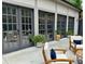 Inviting patio with comfortable seating, potted plants, and multiple glass doors for seamless indoor-outdoor living at 591 E Morningside Ne Dr, Atlanta, GA 30324