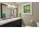 Bathroom featuring a double sink vanity, large mirror and bright natural light at 727 Channing Nw Dr, Atlanta, GA 30318