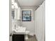 Classic bathroom featuring white tiled walls, vanity with sink, and shower with curtain at 727 Channing Nw Dr, Atlanta, GA 30318