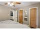 Cozy bedroom boasts a ceiling fan, connecting door to another room, and ample closet space at 727 Channing Nw Dr, Atlanta, GA 30318