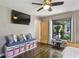 Bright bedroom with hardwood floors and a window overlooking a green yard at 727 Channing Nw Dr, Atlanta, GA 30318