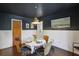 Charming dining room with a round table, unique lighting fixture, and classic wall decor at 727 Channing Nw Dr, Atlanta, GA 30318