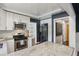 Modern kitchen with white cabinets, stainless steel appliances, and a light countertop at 727 Channing Nw Dr, Atlanta, GA 30318