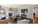 Spacious living room with wood floors, fireplace, television, and neutral decor at 727 Channing Nw Dr, Atlanta, GA 30318