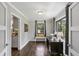 A home office with hardwood floors, a desk and natural light from two windows at 727 Channing Nw Dr, Atlanta, GA 30318