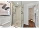 Modern bathroom with a glass shower, stylish paint and unique art at 130 26Th Nw St # 801, Atlanta, GA 30309