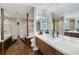 Bathroom with double sinks, mirrors, and a tub at 130 26Th Nw St # 801, Atlanta, GA 30309