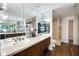 Elegant bathroom with double sinks, framed mirrors, granite counters and a glass shower at 130 26Th Nw St # 801, Atlanta, GA 30309