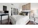 Cozy bedroom with modern decor, French doors, and dark hardwood floors at 130 26Th Nw St # 801, Atlanta, GA 30309