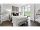 Inviting bedroom with seating area, large window and comfortable decor at 130 26Th Nw St # 801, Atlanta, GA 30309