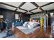 Modern bedroom boasts a black and white accent wall, overhead lighting, and hardwood floors at 130 26Th Nw St # 801, Atlanta, GA 30309