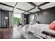 Bedroom with exercise equipment and view of trees from the balcony at 130 26Th Nw St # 801, Atlanta, GA 30309