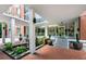 Elegant building entrance with water feature, greenery, and ample natural light for a welcoming ambiance at 130 26Th Nw St # 801, Atlanta, GA 30309