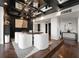 Chic dining area with dark wood flooring and a statement ceiling with black beams at 130 26Th Nw St # 801, Atlanta, GA 30309