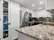 Well-lit kitchen with stainless appliances, granite counters, and ample storage at 130 26Th Nw St # 801, Atlanta, GA 30309
