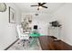 Bright home office with stylish décor, featuring an ergonomic white chair, a computer and monitor at 130 26Th Nw St # 801, Atlanta, GA 30309