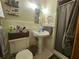 Classic bathroom featuring a pedestal sink and shower with a curtain at 2564 Wren Nw Ave, Duluth, GA 30096
