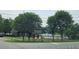 Community pool and clubhouse amenities in a scenic lakefront setting, enhancing leisure and recreation at 2564 Wren Nw Ave, Duluth, GA 30096