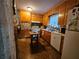 A cozy kitchen with honey oak cabinetry, and decorative accents at 2564 Wren Nw Ave, Duluth, GA 30096