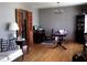 Inviting living room with hardwood floors, a chandelier, and bi-fold doors at 2564 Wren Nw Ave, Duluth, GA 30096