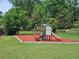 Community playground featuring a slide and swings surrounded by a well-maintained lawn and secure fencing at 2564 Wren Nw Ave, Duluth, GA 30096
