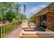 Back deck featuring an outdoor seating area, pillows, and a grill at 29 Parkwood Ne Dr, Kennesaw, GA 30144
