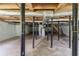 Unfinished basement with support beams, wooden ceiling, and utilities visible at 29 Parkwood Ne Dr, Kennesaw, GA 30144