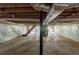 Spacious unfinished basement featuring support beams, a staircase, and wood ceiling at 29 Parkwood Ne Dr, Kennesaw, GA 30144