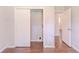 Bedroom featuring closet and entry doors with brown wood floors at 29 Parkwood Ne Dr, Kennesaw, GA 30144