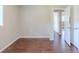 Bedroom featuring closet and entry doors with brown wood floors at 29 Parkwood Ne Dr, Kennesaw, GA 30144