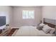 Bedroom with a plush bed, modern furnishings, and a large window at 29 Parkwood Ne Dr, Kennesaw, GA 30144