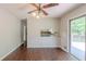 Bright dining area with wood paneling, a vintage fan, and sliding doors to the deck at 29 Parkwood Ne Dr, Kennesaw, GA 30144