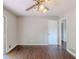 Dining area featuring a ceiling fan, a sliding glass door, and vinyl paneled walls at 29 Parkwood Ne Dr, Kennesaw, GA 30144