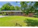 Charming one-story brick home with a carport and large front yard at 29 Parkwood Ne Dr, Kennesaw, GA 30144