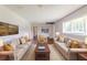 Bright living room furnished with sofas, coffee table, rug and wall art at 29 Parkwood Ne Dr, Kennesaw, GA 30144
