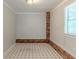 Small room with brick accents along the baseboards and a checkered tile floor at 29 Parkwood Ne Dr, Kennesaw, GA 30144