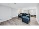 Finished basement area with neutral paint, vinyl floors, and comfortable seating at 642 Towering Pine Trl, Lawrenceville, GA 30045