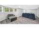 Spacious basement area with wood flooring and ample light coming from windows at 642 Towering Pine Trl, Lawrenceville, GA 30045