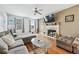 Inviting living room features a fireplace, hardwood floors, and neutral decor at 642 Towering Pine Trl, Lawrenceville, GA 30045