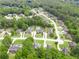 Aerial view of a neighborhood showcasing well-maintained lawns and mature trees at 811 Ivy Ridge Dr, Loganville, GA 30052