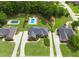 Beautiful aerial view of the home showing the pool, driveway, and lush green lawn at 811 Ivy Ridge Dr, Loganville, GA 30052