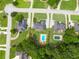 An aerial shot features a home with a swimming pool surrounded by trees in a residential area at 811 Ivy Ridge Dr, Loganville, GA 30052