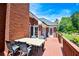 Back deck with outdoor seating area, and a view of the green lawn at 811 Ivy Ridge Dr, Loganville, GA 30052