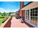 Back deck offers a view of the beautifully landscaped green lawn and sky at 811 Ivy Ridge Dr, Loganville, GA 30052