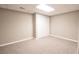 Finished basement bedroom with closet space and neutral carpeting at 811 Ivy Ridge Dr, Loganville, GA 30052