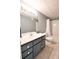 Basement bathroom featuring vanity with tub/shower and neutral tile flooring at 811 Ivy Ridge Dr, Loganville, GA 30052